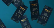 Photograph of scattered invitational brochures for the competition ACM Gia Dinh 2022. They are seen floating on a blue background.